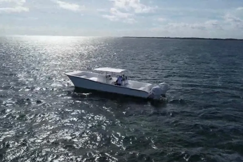 Slide: The Image of 2025 AmeraCat 39 boat cruising on open water under a sunny sky. - 4