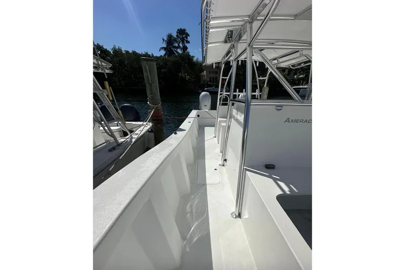 Slide: The Image of 2025 AmeraCat 39 boat docked, featuring sleek design and sturdy metal framework. - 7