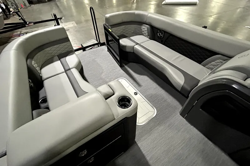 Slide: The Image of 2026 Godfrey Monaco 255 QSL interior with luxurious gray seating and cup holders. - 12