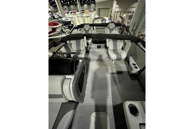 Slide: The Image of 2026 Godfrey Monaco 255 QSL boat interior with modern seating and sleek design. - 14
