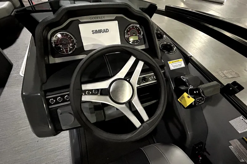 Slide: The Image of Steering console of 2026 Godfrey Monaco 255 QSL with Simrad display and controls. - 5