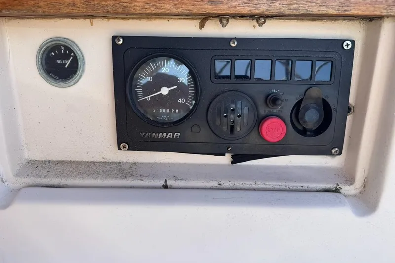 Slide: The Image of Control panel of a 1989 Island Packet 35 sailboat with Yanmar engine gauges. - 12