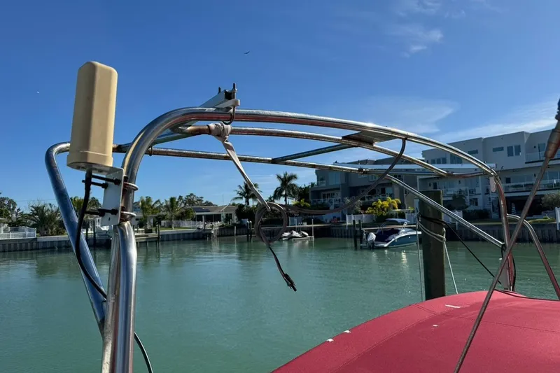 Slide: The Image of 1989 Island Packet 35 sailboat docked in a sunny marina with clear skies. - 20