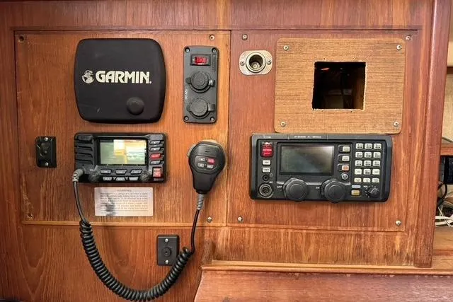Slide: The Image of Control panel of a 1989 Island Packet 35 sailboat with Garmin navigation equipment. - 44