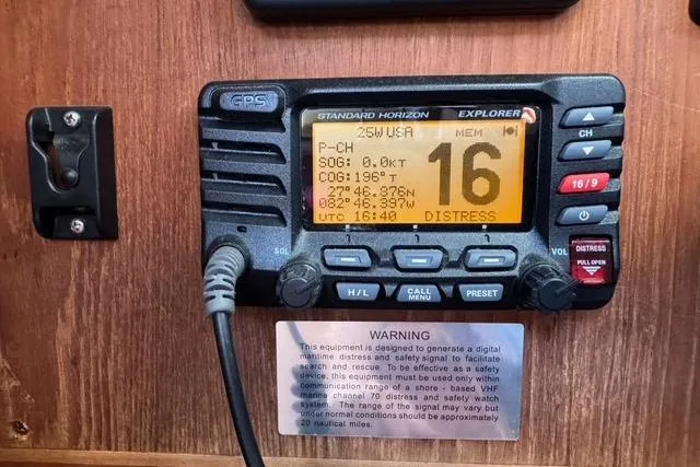 Slide: The Image of VHF radio on 1989 Island Packet 35 sailboat, displaying distress signal on channel 16. - 46