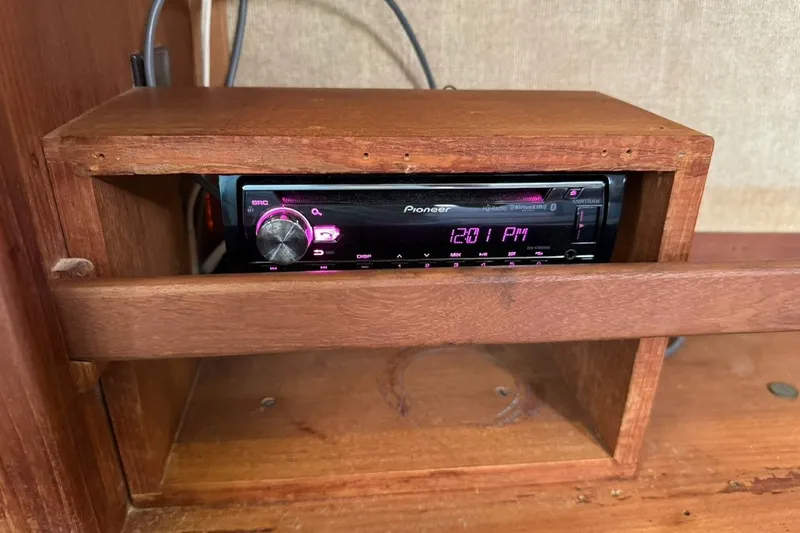 Slide: The Image of Pioneer stereo system in wooden cabinet on 1989 Island Packet 35 sailboat. - 49