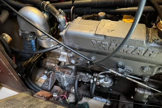Slide: The Image of Engine compartment of a 1989 Island Packet 35 sailboat with Yanmar engine. - 53