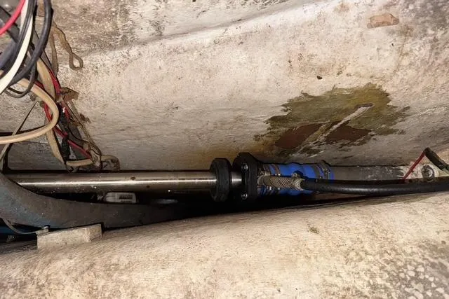 Slide: The Image of 1989 Island Packet 35 boat interior showing mechanical components and wiring. - 56