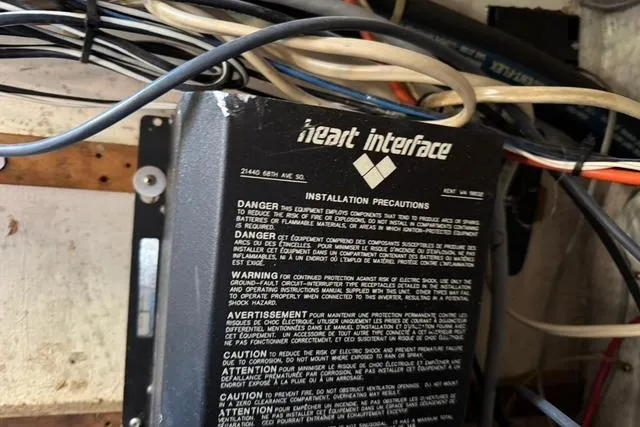 Slide: The Image of Electrical panel with Heart Interface installation precautions on 1989 Island Packet 35 sailboat. - 59