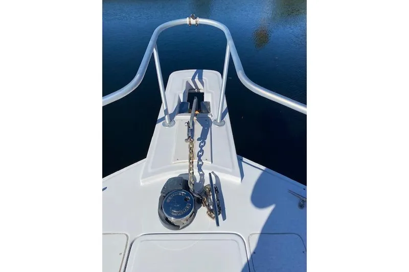 Slide: The Image of 1999 Mainship 350 Trawler bow with anchor chain and winch system. - 21