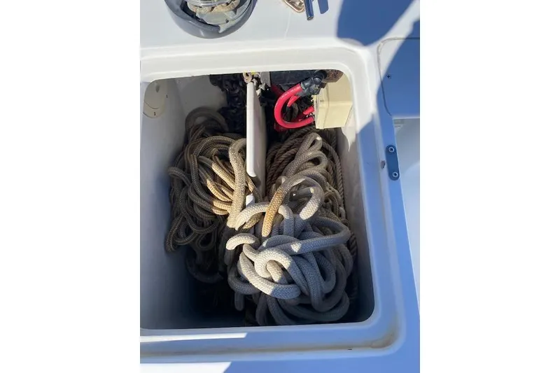 Slide: The Image of Coiled ropes in storage compartment of 1999 Mainship 350 Trawler boat. - 22