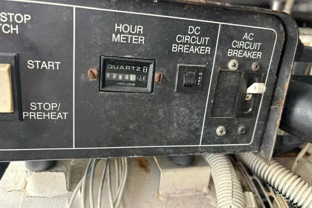 Slide: The Image of Control panel of 1999 Mainship 350 Trawler with hour meter and circuit breakers. - 27