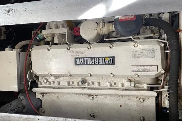 Slide: The Image of Engine compartment of a 1999 Mainship 350 Trawler with a Caterpillar engine. - 30