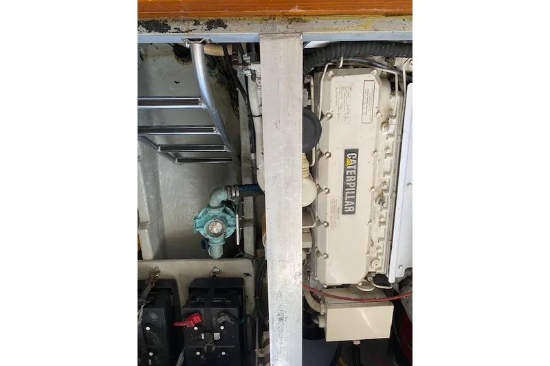 Slide: The Image of Engine compartment of a 1999 Mainship 350 Trawler with Caterpillar engine visible. - 50