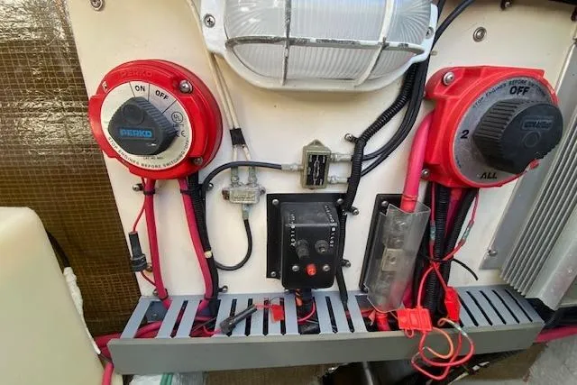 Slide: The Image of Electrical panel of a 1999 Mainship 350 Trawler with switches and wiring. - 51