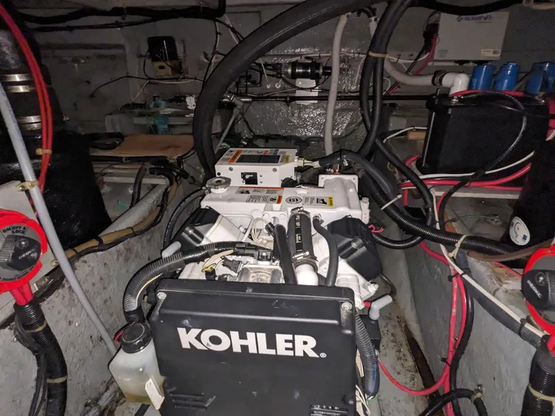 Slide: The Image of Engine room of 1988 Sea Ray 390 Express Cruiser with Kohler generator. - 14