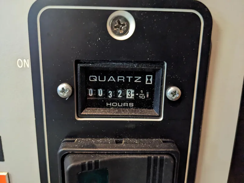 Slide: The Image of Hour meter showing 323.1 hours on 1988 Sea Ray 390 Express Cruiser. - 25