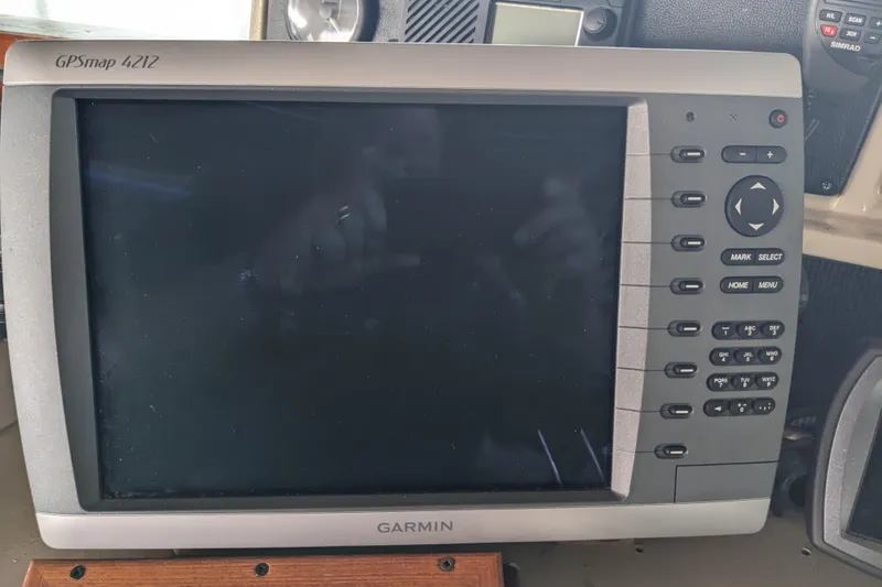 Slide: The Image of Garmin GPSmap 4212 on 1988 Sea Ray 390 Express Cruiser dashboard. - 37