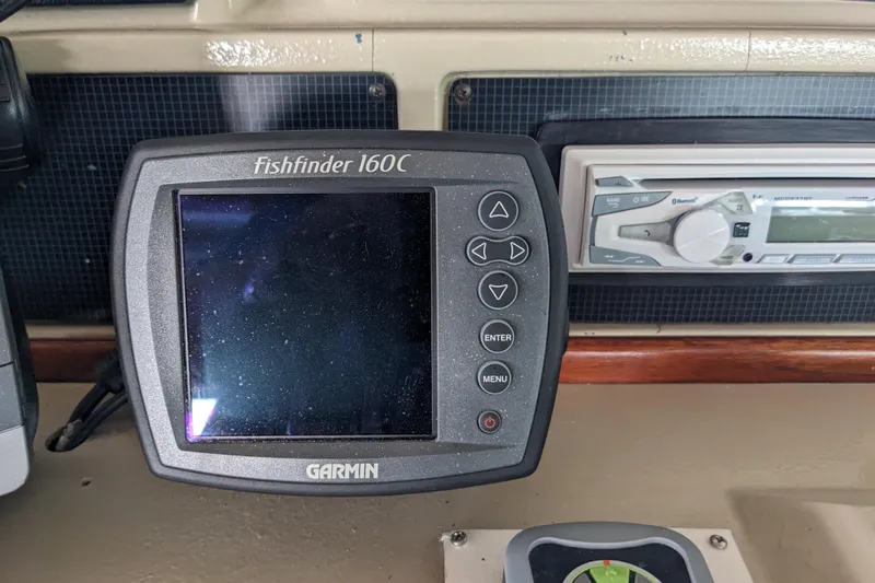 Slide: The Image of Garmin Fishfinder 160C on 1988 Sea Ray 390 Express Cruiser dashboard. - 38