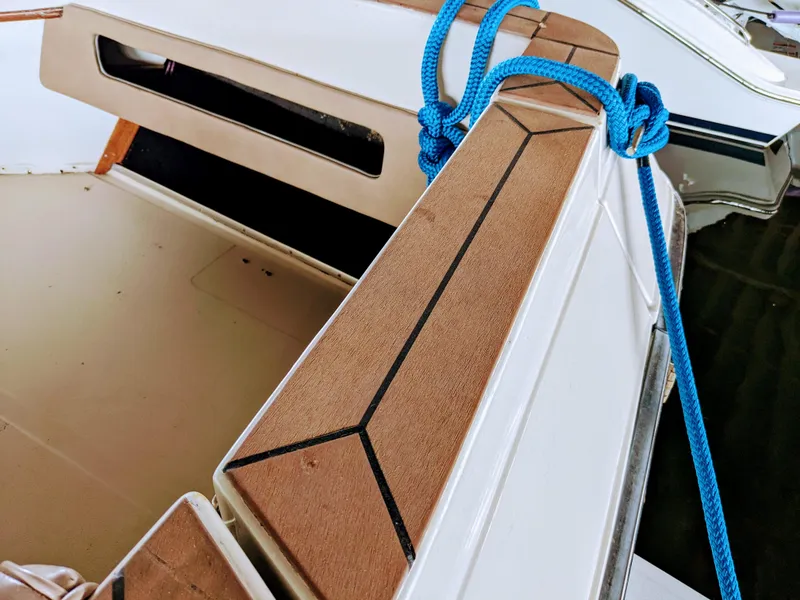 Slide: The Image of 1988 Sea Ray 390 Express Cruiser with blue rope and teak deck detail. - 5