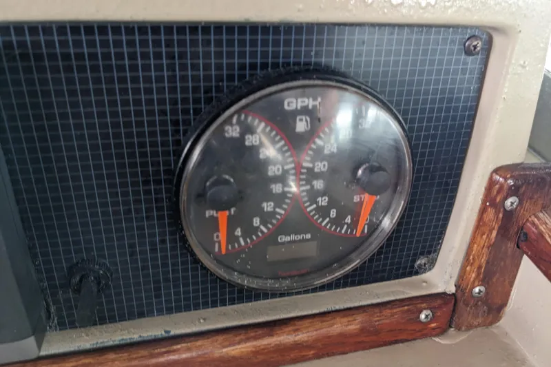 Slide: The Image of Gauge panel of a 1988 Sea Ray 390 Express Cruiser showing fuel consumption. - 51