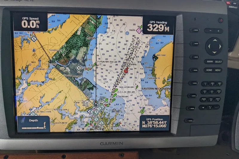 Slide: The Image of Garmin GPS display on 1988 Sea Ray 390 Express Cruiser showing nautical map and coordinates. - 53