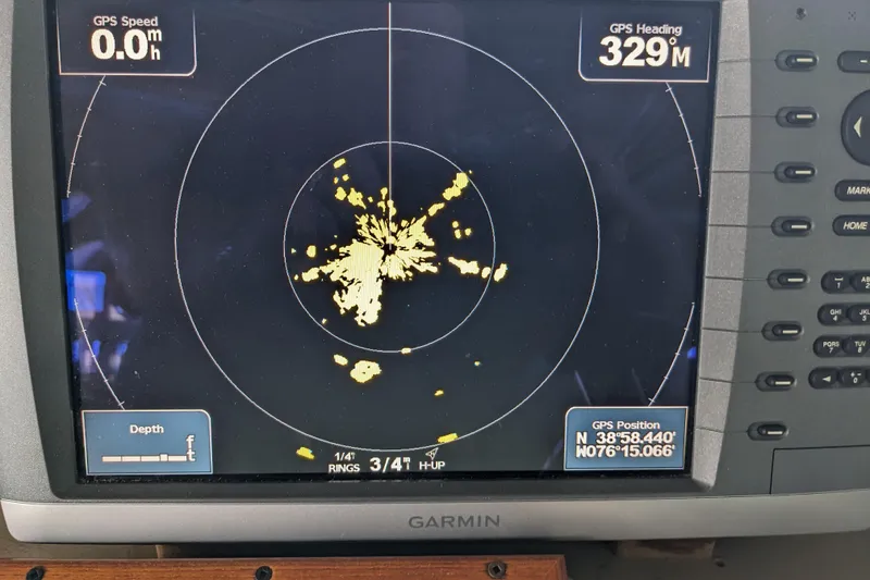Slide: The Image of Garmin GPS display on 1988 Sea Ray 390 Express Cruiser showing heading and position. - 54
