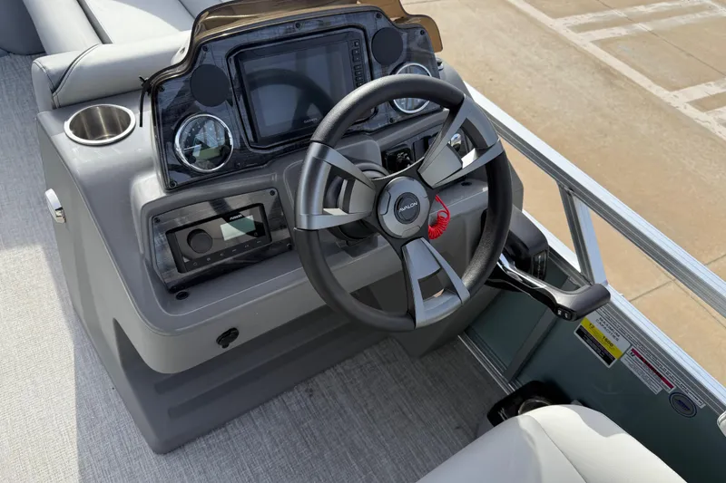 Slide: The Image of 2026 Avalon Venture 85 Versatile rear bench steering console with modern controls and cup holder. - 22