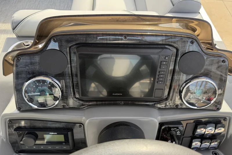 Slide: The Image of Dashboard of 2026 Avalon Venture 85 Versatile with Garmin display and controls. - 24