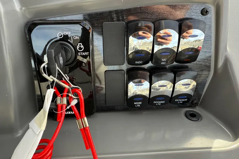 Slide: The Image of Control panel of 2026 Avalon Venture 85 Versatile with ignition and labeled switches. - 28