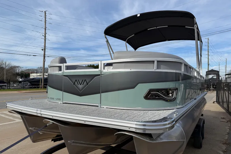 Slide: The Image of 2026 Avalon Venture 85 Versatile Rear Bench pontoon boat with sleek design and canopy. - 3
