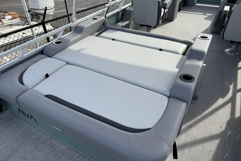 Slide: The Image of 2026 Avalon Venture 85 Versatile rear bench with cup holders on a boat deck. - 38