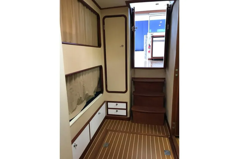 Slide: The Image of Interior of 2001 Wesmac 38 boat with wooden stairs and cabinetry. - 21