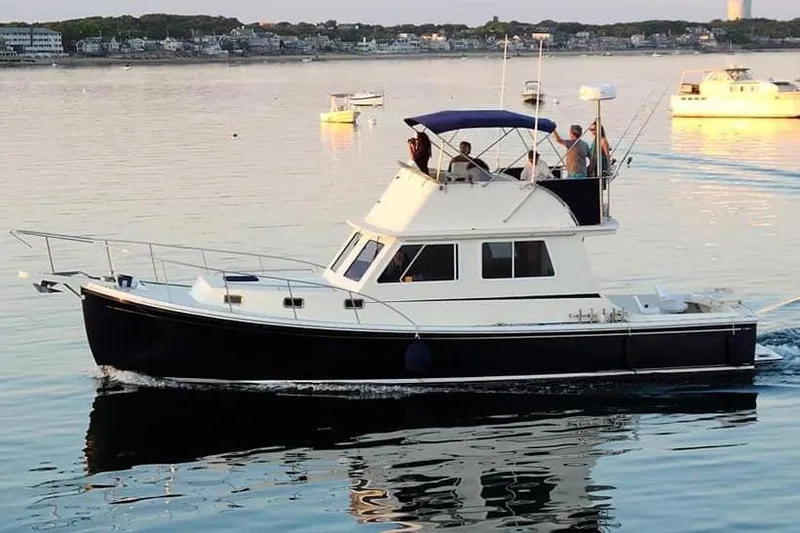 Slide: The Image of 2001 Wesmac 38 boat cruising on calm waters. - 3