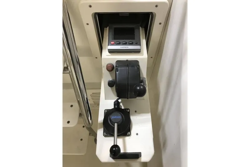 Slide: The Image of Control panel of a 2001 Wesmac 38 boat with Garmin equipment. - 8