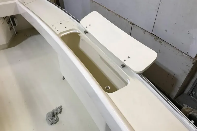 Slide: The Image of Wesmac 38 boat interior detail, 2001 model, featuring storage compartment and clean design. - 9