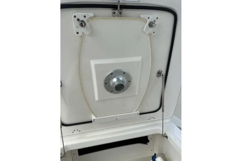 Slide: The Image of Portable toilet inside 2024 Boston Whaler 250 Dauntless boat cabin. - 11