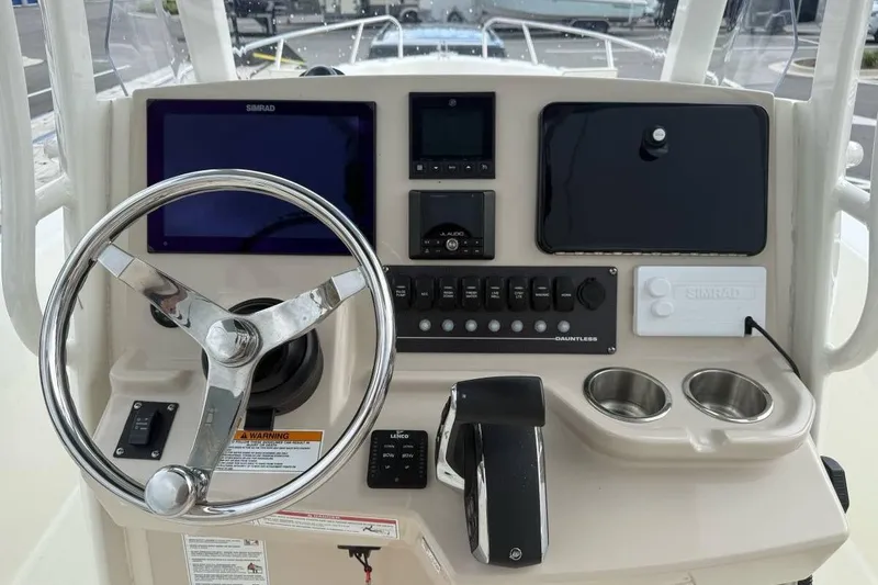 Slide: The Image of 2024 Boston Whaler 250 Dauntless boat interior with seating and storage features. - 3