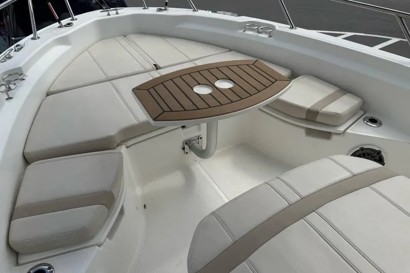 Slide: The Image of 2024 Boston Whaler 250 Dauntless boat with spacious cushioned seating area. - 6