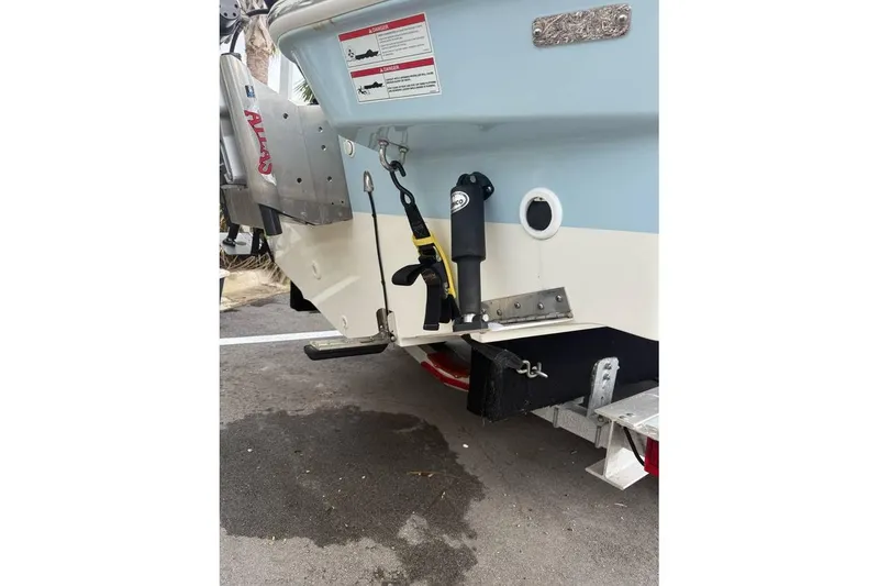 Slide: The Image of 2024 Boston Whaler 250 Dauntless boat seat with black cover, outdoor setting. - 8