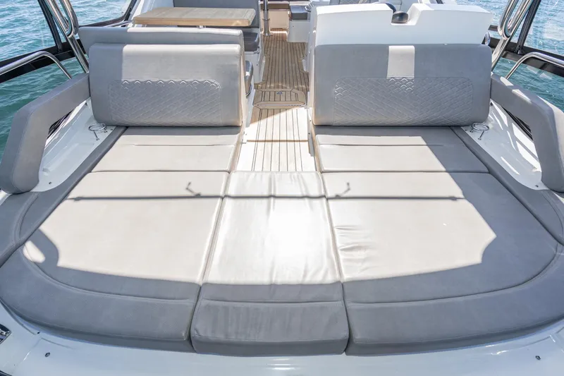 Slide: The Image of 2018 Sea Ray L590 Fly yacht with spacious sunbathing area and luxurious seating. - 15
