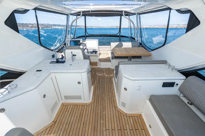 Slide: The Image of 2018 Sea Ray L590 Fly yacht interior with modern amenities and ocean view. - 22