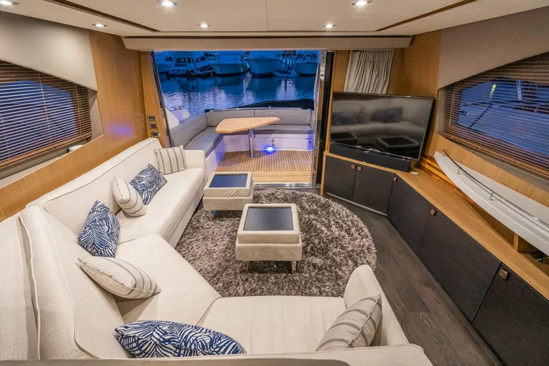 Slide: The Image of Luxurious interior of 2018 Sea Ray L590 Fly yacht with modern furnishings and waterfront view. - 32