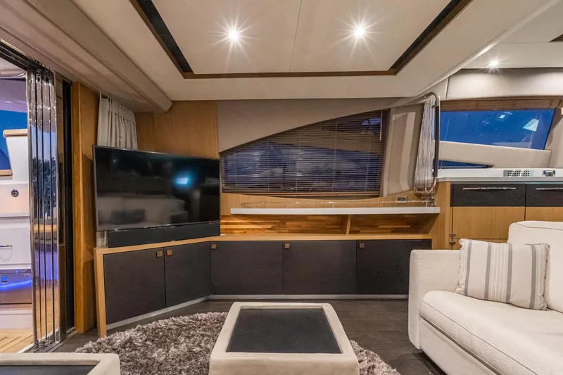 Slide: The Image of Luxurious interior of 2018 Sea Ray L590 Fly yacht with modern furnishings and ambient lighting. - 35