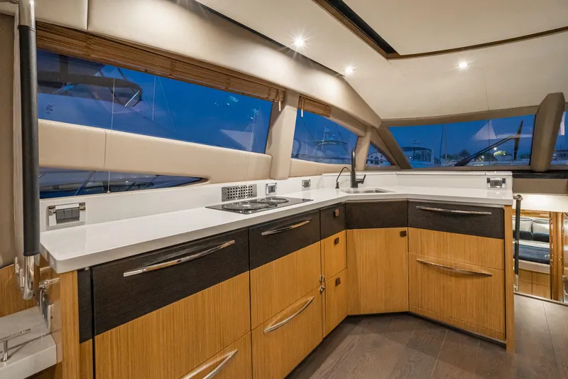 Slide: The Image of Modern kitchen interior of 2018 Sea Ray L590 Fly yacht with sleek cabinetry. - 37