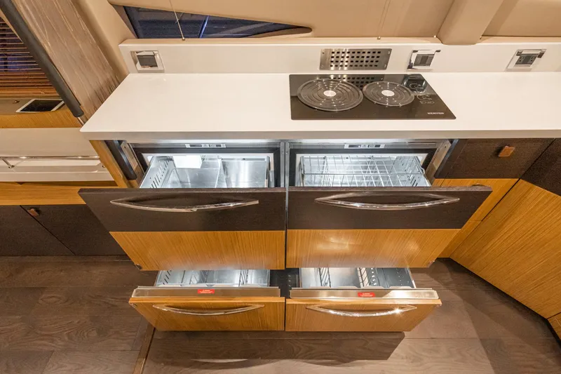Slide: The Image of Modern kitchen area in 2018 Sea Ray L590 Fly yacht with open drawers. - 38