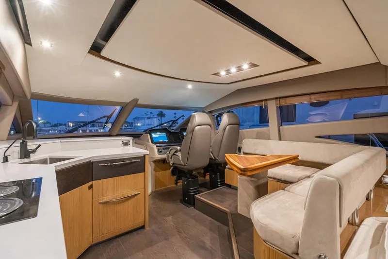 Slide: The Image of Interior of 2018 Sea Ray L590 Fly yacht with modern helm and seating area. - 44