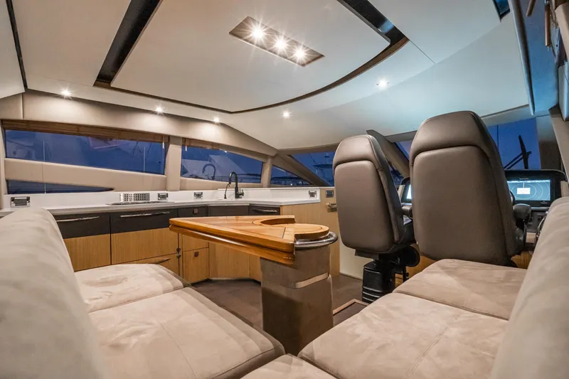 Slide: The Image of Interior of 2018 Sea Ray L590 Fly yacht with modern seating and sleek design. - 47
