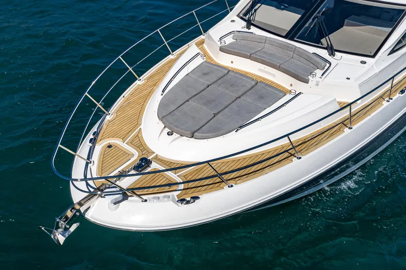 Slide: The Image of 2018 Sea Ray L590 Fly yacht with teak deck and sunbathing area. - 6