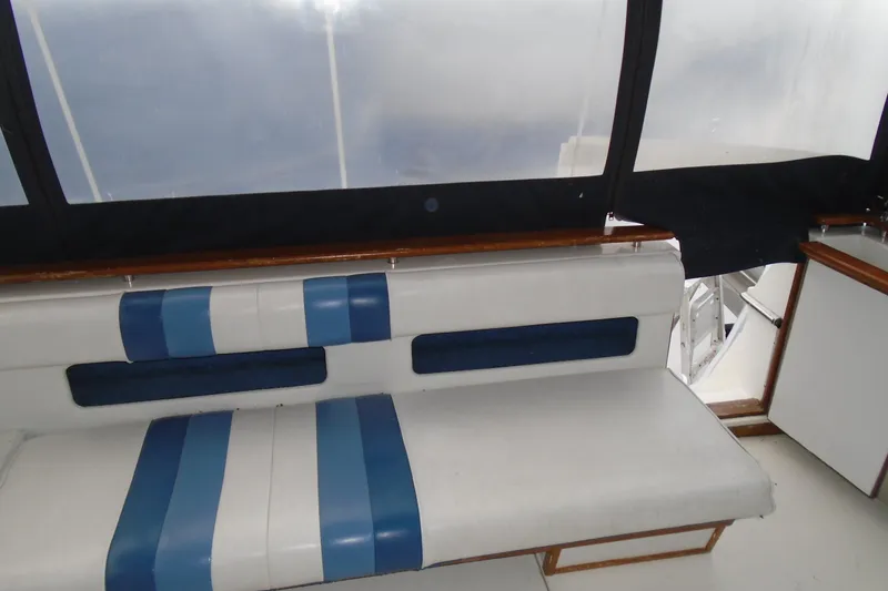 Slide: The Image of 1989 Sea Ray 300 Weekender interior with blue and white seating. - 10